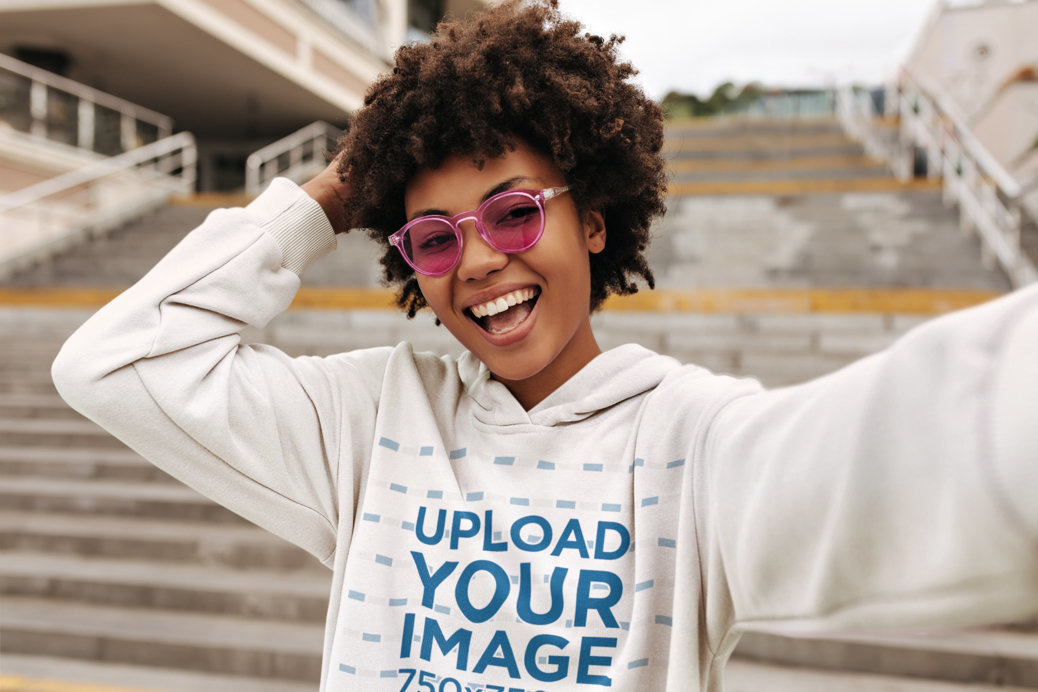 Hoodie Mockup Featuring a Cheerful Woman With Pink Sunglasses