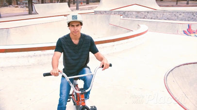 Young Hispanic Man Riding a Bike in a Skatepark Wearing a Snapback Hat Video a14189