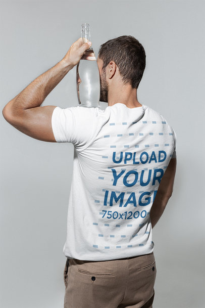 Back-View T-Shirt Mockup of a Man Holding a Glass Bottle on His Shoulder m28423