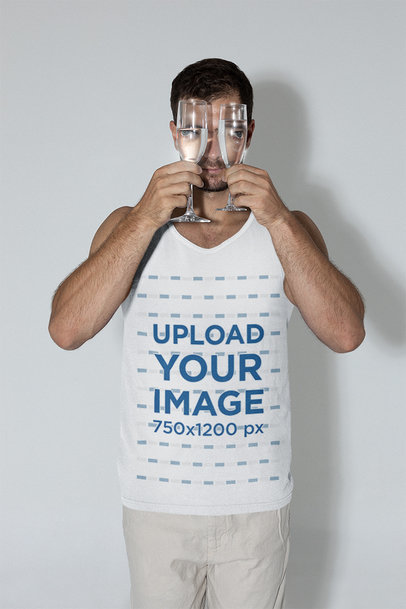 Tank Top Mockup of a Man Holding Two Wine Glasses to His Face