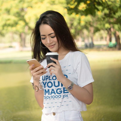 Round-Neck Tee Mockup of a Woman Checking Her Mobile Phone by a Lake m17938 r-el2