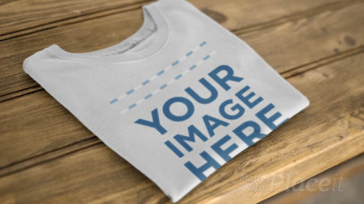 Folded T-Shirt Lying on a Wooden Table Video