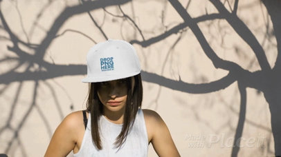 Woman Wearing a Snapback Hat Video Under a Tree Shadows