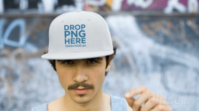 Young Hipster Man Wearing a Snapback Hat Video While at a Skate Park a14163