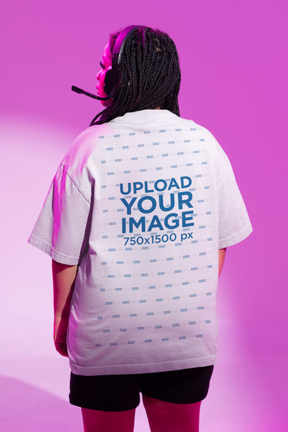 Back-View Tee Mockup of a Woman Wearing a Gaming Headset m28493