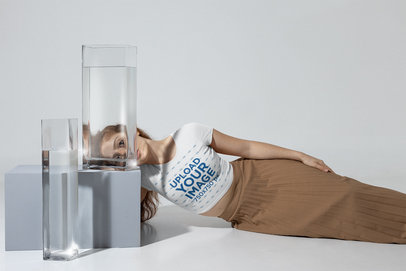 Crop Top Mockup of a Woman Posing Next to Vases With Water at a Studio m28399