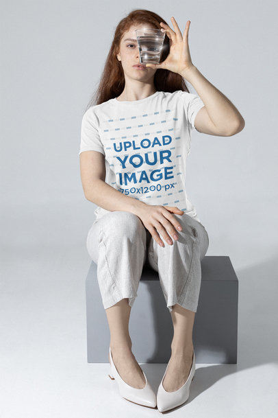 Bella Canvas Tee Mockup of a Woman Looking Through a Glass of Water m28391