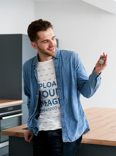 Round-Neck T-Shirt Mockup Featuring a Happy Man Holding a House Key m26476 r-el2