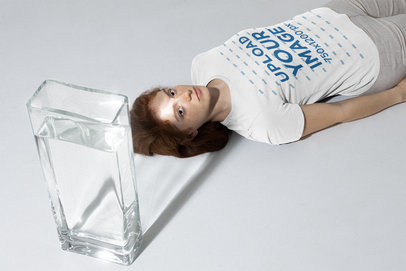 Bella Canvas T-Shirt Mockup of a Woman Laying on the Floor