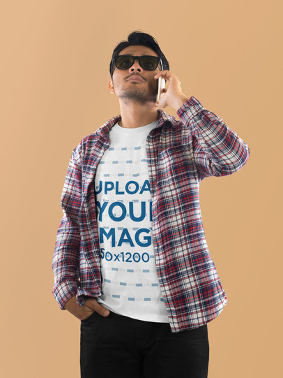 T-Shirt Mockup of a Man with Sunglasses Taking on His Mobile Phone m18064 r-el2