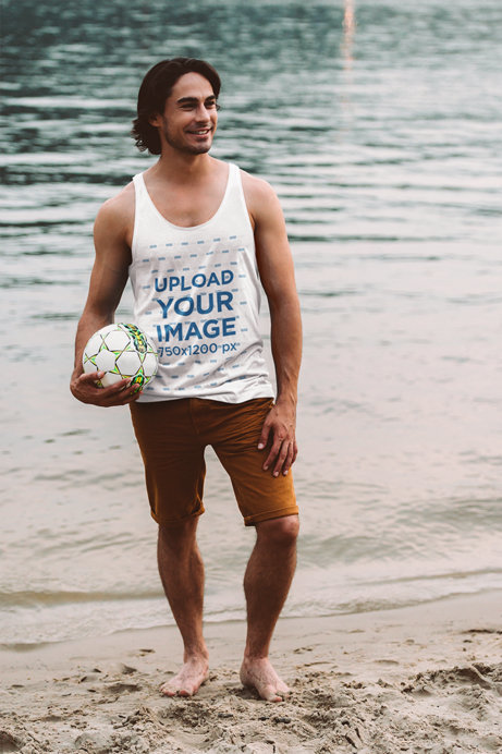Heathered Tank Top Mockup of a Man at the Beach Holding a Soccer Ball
