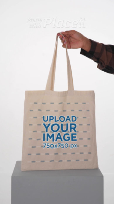 Video of a Happy Woman With an Afro Hairstyle Holding a Tote Bag
