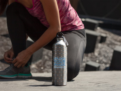 Aluminum Water Bottle Mockup Featuring a Woman Tiding up her Shoes 14883a
