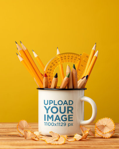 Enamel Coffee Mug Mockup Featuring Some Pencils and a Protractor