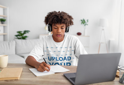 Round-Neck Tee Mockup of a Teenage Boy Doing Homework