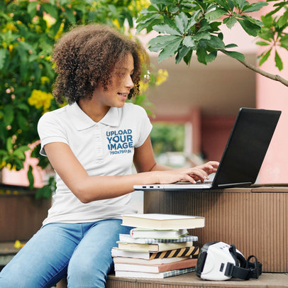 Polo Shirt Mockup of a Student Using Her Computer at a Campus