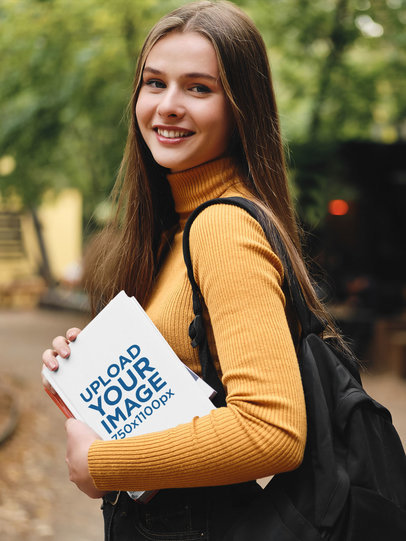 Mockup of a Woman With a Backpack Holding a Book
