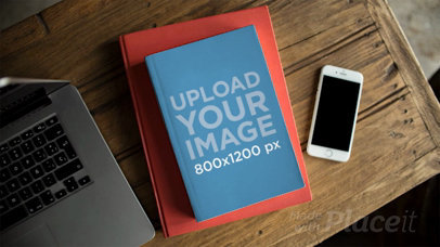 Book Moving in Stop Motion on Top of a Red Book on a Table 