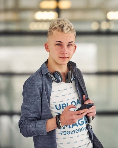 Heathered V-Neck T-Shirt Mockup of a Young Man with Headphones Around His Neck