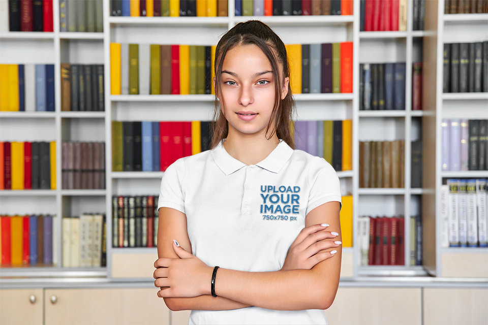 Polo Shirt Mockup Featuring a Serious Teenage Girl Posing at the Library