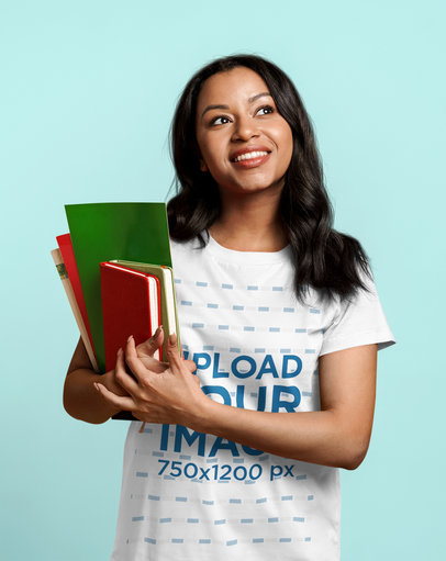 T-Shirt Mockup of a Smiling Teacher Holding Books m24596 r-el2