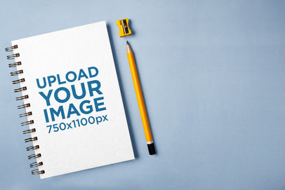 Spiral Notebook Mockup Featuring a Pencil and a Sharpener m28873 r-el2