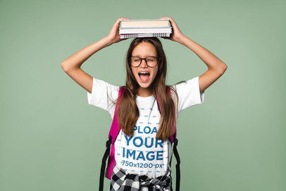 T-Shirt Mockup of a Long-Haired Girl Carrying Some Books on Her Head