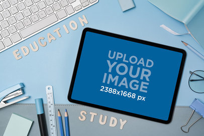 Mockup of an iPad Surrounded by School Supplies Placed on a Blue Background m28838 r-el2