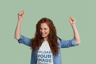 T-Shirt Mockup of a Happy Woman in a Cheering Pose