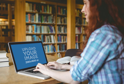 Mockup of a Serious Woman Working on Her MacBook at a Library