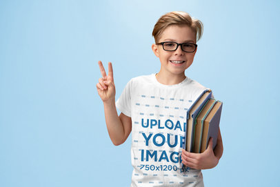 Tee Mockup of a Happy Kid with Glasses Carrying Some Books m28650 r-el2