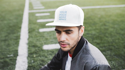 Young Man Wearing a Hat Stop Motion at a Football Field a13691