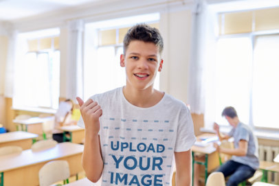 Heathered T-Shirt Mockup of a Happy Student Inside a Classroom