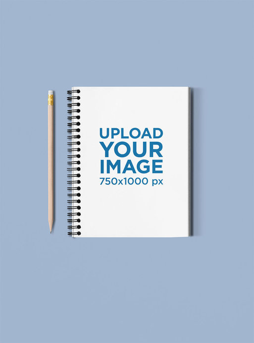 Spiral Notebook Mockup Featuring a Pencil Next to It