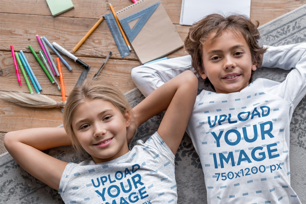 T-Shirt and Long Sleeve Tee Mockup of a Girl and a Boy Lying on a Floor Carpet