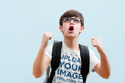 Heathered T-Shirt Mockup Featuring a Euphoric Boy With a Backpack