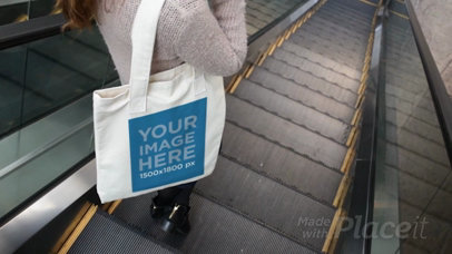 Woman Taking an Escalator While Holding a Tote Bag Video