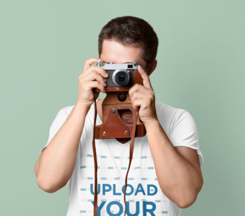 V-Neck T-Shirt Mockup of a Man Taking a Picture With a Vintage Camera m26318 r-el2