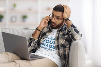 T-Shirt Mockup Featuring a Serious Man Talking on the Phone
