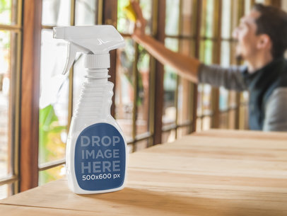 White Spray Bottle Mockup On Wooden Table With Man Cleaning