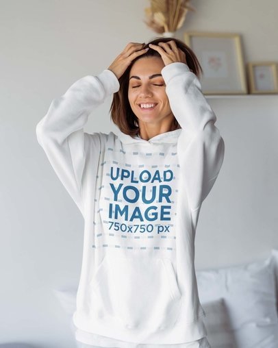 Hoodie Mockup Featuring a Smiling Woman Grabbing Her Hair