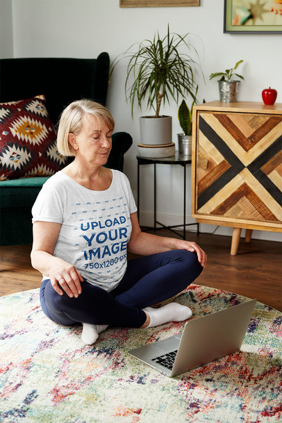 Heathered Tee Mockup of an Elderly Woman Meditating at Home