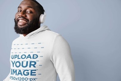 Hoodie Mockup Featuring a Happy Man With Headphones