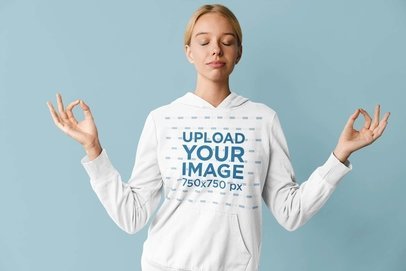 Hoodie Mockup Featuring a Young Woman Doing a Yoga Position m28286 r-el2