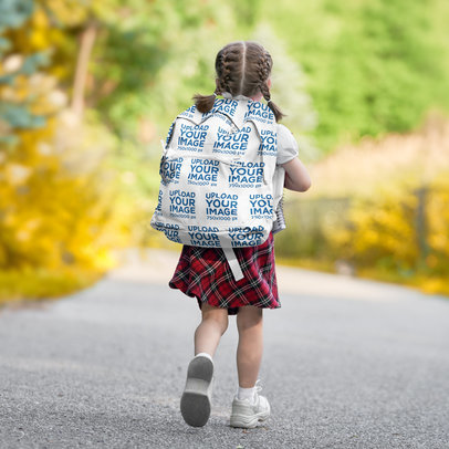 Backpack Mockup of a Little Girl Walking on the Road