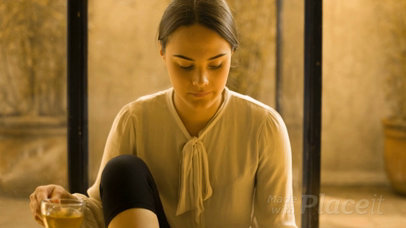 Young Girl Looking at a Book While Drinking a Tea in a Yoga Pose Video a14170