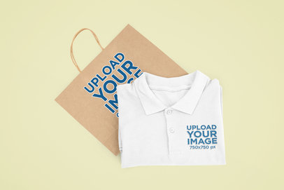 Mockup of a Polo Shirt With a Paper Bag Placed at a Customizable Background