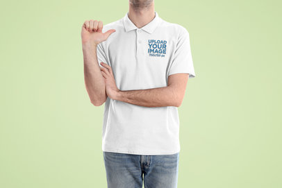 Mockup of a Man at a Studio Pointing at His Polo Shirt