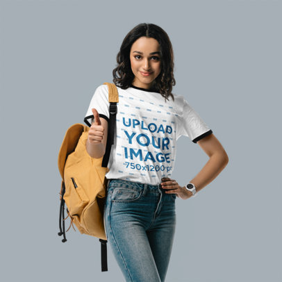 Ringer T-Shirt Mockup Featuring a Student Woman Giving Thumbs Up in a Studio m18106 r-el2