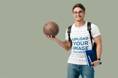 Heathered Tee Mockup Featuring a Student Holding a Basketball Ball